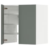 Displays a METOD kitchen cabinet in matte grey-green, featuring adjustable shelves.