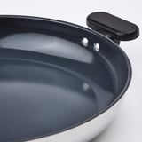 Clean, stylish pan with dark non-stick interior and black handle, showcasing quality craftsmanship.
