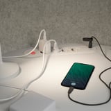 Work pod with integrated power strips, charging phone, and soundproof walls, enhancing focus and privacy.