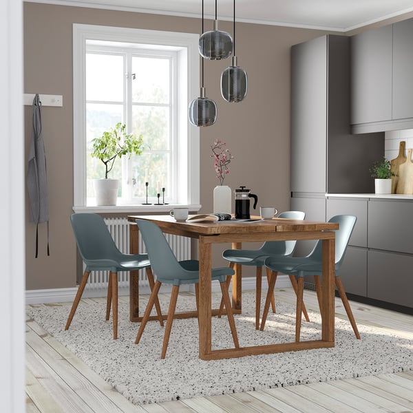 Modern dining room with wooden table & blue chairs