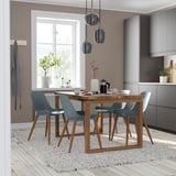 Modern dining room with wooden table & blue chairs