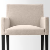 Modern upholstered chair with beige fabric, squared arms, and sturdy wooden legs. High-quality design for comfort and durability.