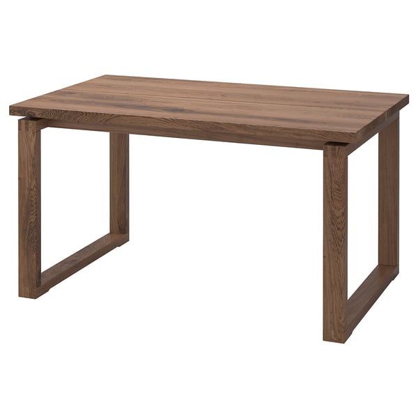 A brown MÖRBYLÅNGA dining table with a thick oak veneer top and solid wood legs, featuring a simple, rectangular design.