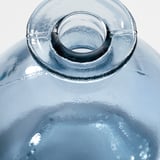 Clear glass vase, handcrafted with visible air bubbles and color variations, showcasing an honest, unique look.