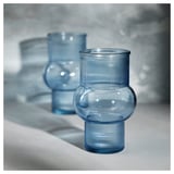 Three blue recycled glass vases in varied shapes and sizes.