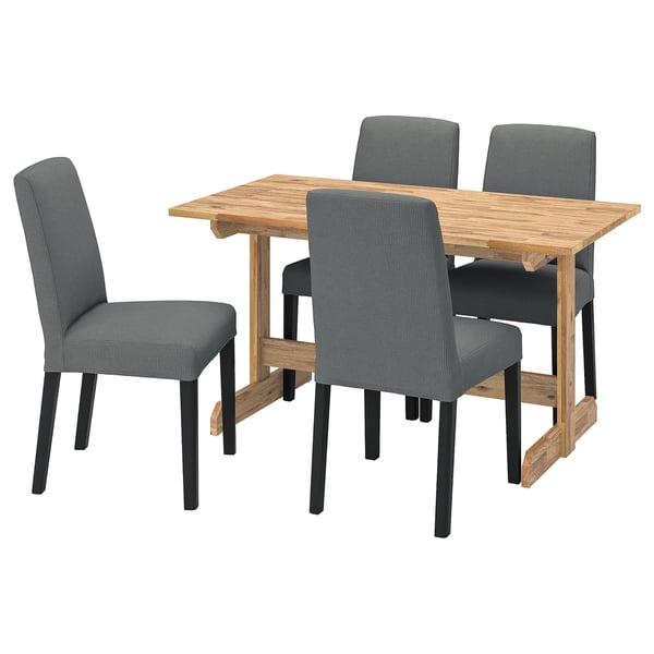 Square wooden dining table with four grey fabric chairs. Simple, modern design.