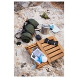 NÄMMARÖ furniture: wooden chair, green blanket, thermos on rocks