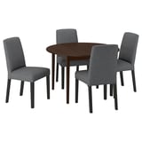Four gray upholstered dining chairs around a dark brown round wooden table. Modern, sleek design.