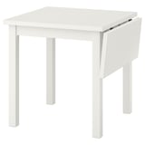 White wooden NORDVIKEN drop-leaf table, square, with sturdy legs and foldable leaf.