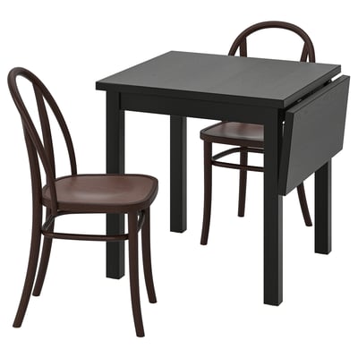 Small black square dining table with two dark wood chairs. Table has drop leaves; chairs have curved backs and seats.