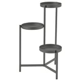 An OLIVBLAD gray metal plant stand with three circular shelves at varying heights.
