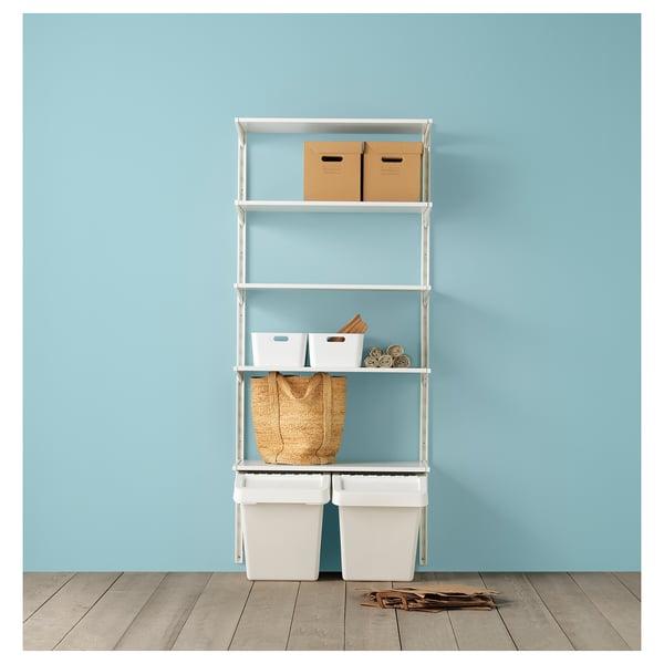 White metal shelving unit against blue wall with storage bins and boxes.
