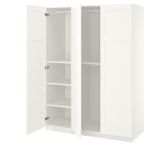 A white ikea PAX wardrobe with open doors, revealing empty shelves inside. Its minimalistic and modern, ideal for storage.
