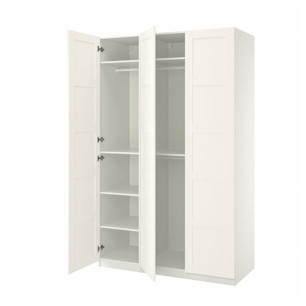 IKEA PAX white wardrobe, open, white shelves, simple design.