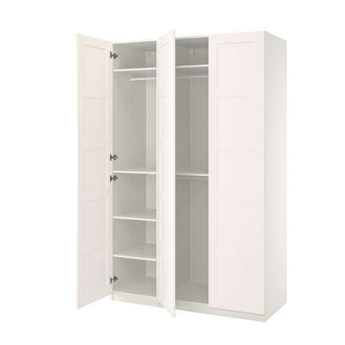 IKEA PAX white wardrobe, open, white shelves, simple design.
