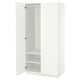 A white ikea PAX wardrobe with mirrored doors and empty interior shelves.