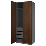 An open PAX wardrobe in dark brown, featuring shelves and drawers.