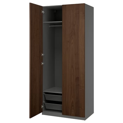 PAX wardrobe in walnut with gray interior, dark wood doors, hanging rail, and mesh baskets.