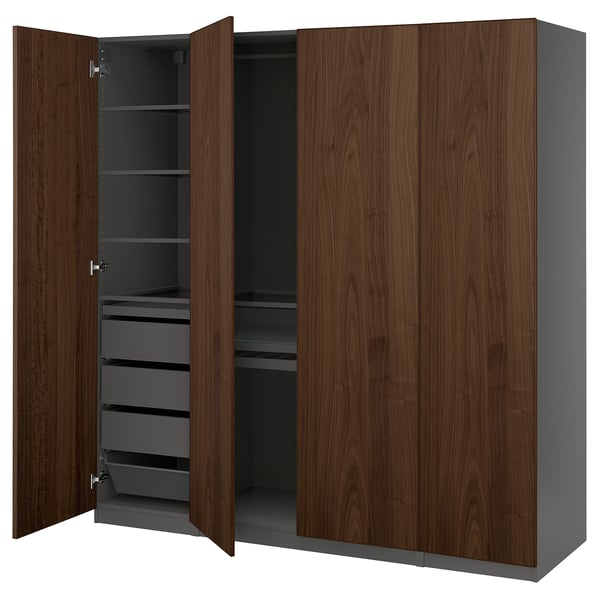 PAX wardrobe in walnut and gray has doors open revealing drawers and shelves.