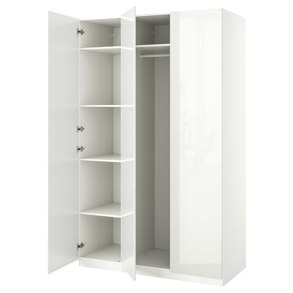 An open white ikea PAX wardrobe with shelves and a hanging rod.
