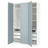 A PAX wardrobe in light blue with shelves and drawers.