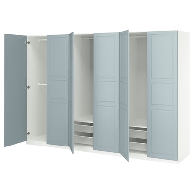 This image shows a blue and white PAX wardrobe with open doors, revealing shelves and storage compartments.