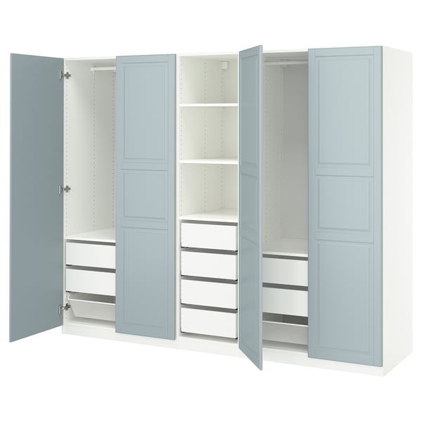 Light blue PAX wardrobe with shelves and drawers, open doors revealing interior.