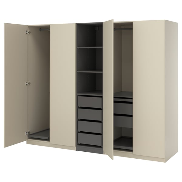 An open beige ikea PAX wardrobe with shelves and drawers.