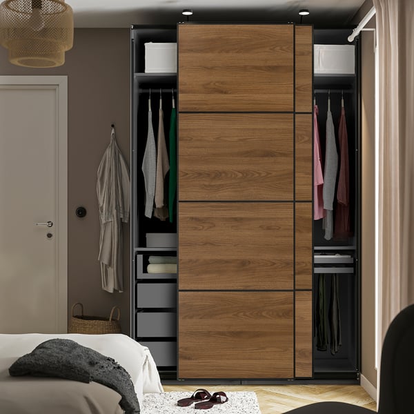 Modern wardrobe with hanging clothes, drawers, and shelves. Sliding doors save space and include glass drawer fronts for easy visibility.