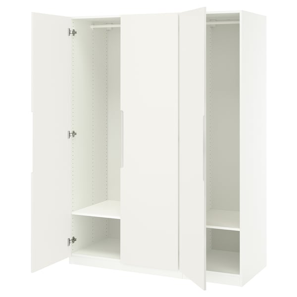 White PAX wardrobe open, showing empty shelves, and soft-close hinges.