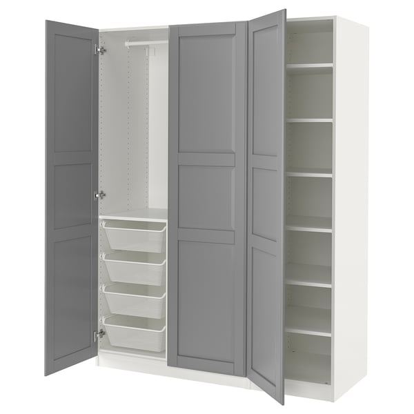 An open white and grey IKEA PAX wardrobe with shelves and mesh baskets.