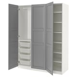 An open white and grey IKEA PAX wardrobe with shelves and mesh baskets.