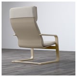 Modern armchair with light wooden frame, high back, and cushioned seating. Offers good back support and a resilient seat.
