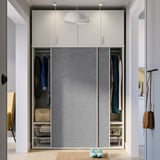 Modern built-in wardrobe with sliding doors and adjustable feet, featuring clothes hangers and storage baskets.