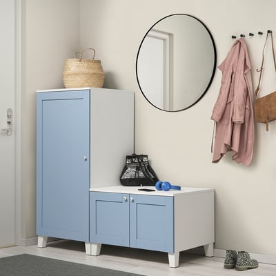 Blue PLATSA storage unit, tall & wide with light legs, in entryway, holding bags & jackets.