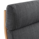 Close-up of poang armchairs soft, cushioned seat with sturdy wooden frame.