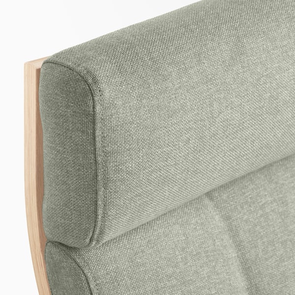 Close-up of upholstered chair edge, light green fabric on wooden frame.