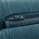 Close-up of a high-quality zipper on a textured blue-green fabric, showcasing durability and detail of the product.