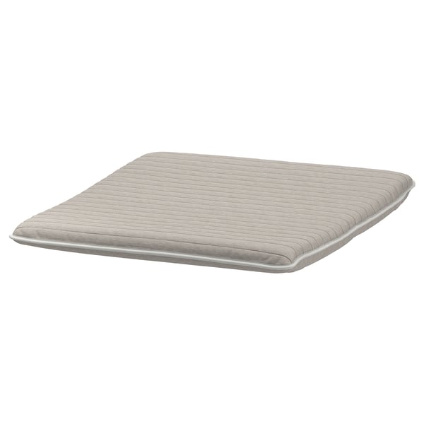 A light beige POÄNG cushion, rectangular with smooth texture, subtle side stitching, made of polyester and foam.