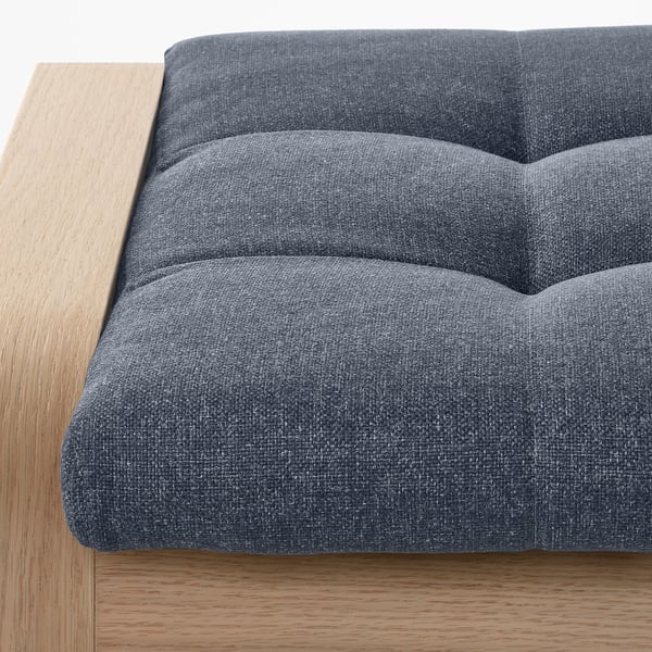 Close-up of a modern, cushioned bench with wooden frame, high-quality upholstery.