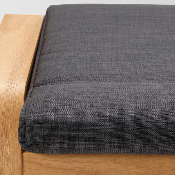 Dark grey cushion on wooden frame, showcasing soft texture and sturdy construction.