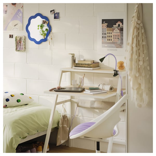 Cozy bedroom with PRUNKHALLON mirror, desk, and bed.