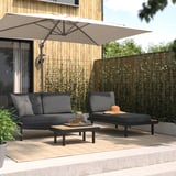 Modern patio lounge set with sofa, chaise, table, and umbrella.