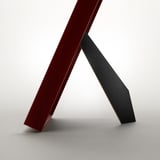 Red picture frame standing on table, displaying photo. Modern, versatile design.