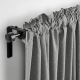 Image shows grey wool-like curtains on black rod with gathered top, demonstrating light-blocking feature.