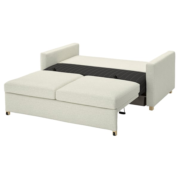 New beige IKEA sofa-bed, light fabric, clean lines, versatile multi-use.