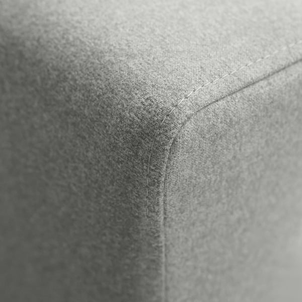 Black & white close-up of sofa corner; smooth texture, clean stitching, high quality.