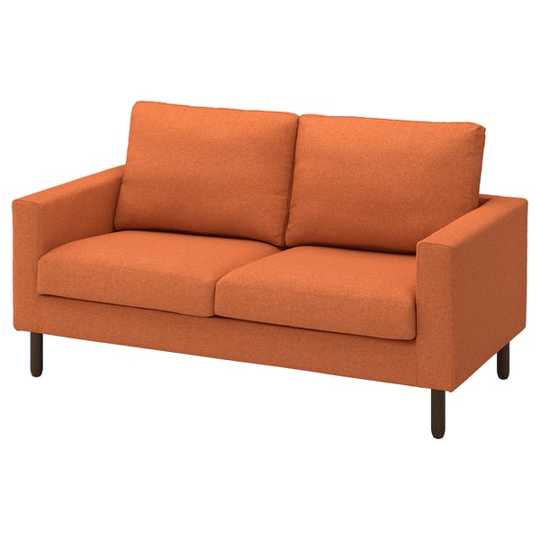 Orange fabric love seat sofa, simple design, soft cushions, wooden legs.