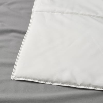 Close-up of smooth, neatly stitched blanket corner, showing high-quality craftsmanship.