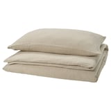 SCHERSMIN greige bedding set, folded. Made of soft muslin cotton, featuring a wavy texture and envelope closure pillows.